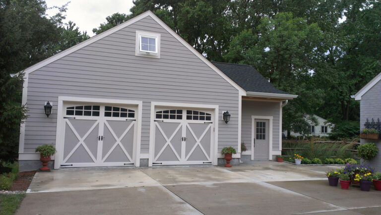 (2) 9' x 8' Overlay Steel Carriage House Doors 5334A Field Painted Gray w/ Stockton Glass