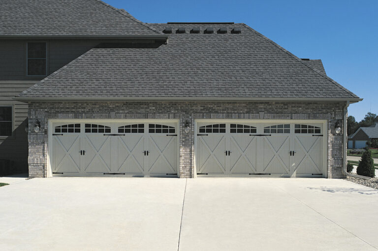 (2) 16' x 7' Carriage House Fiberglass Overlay Door 5534A Sandstone w/ 2 Piece Stockton Glass